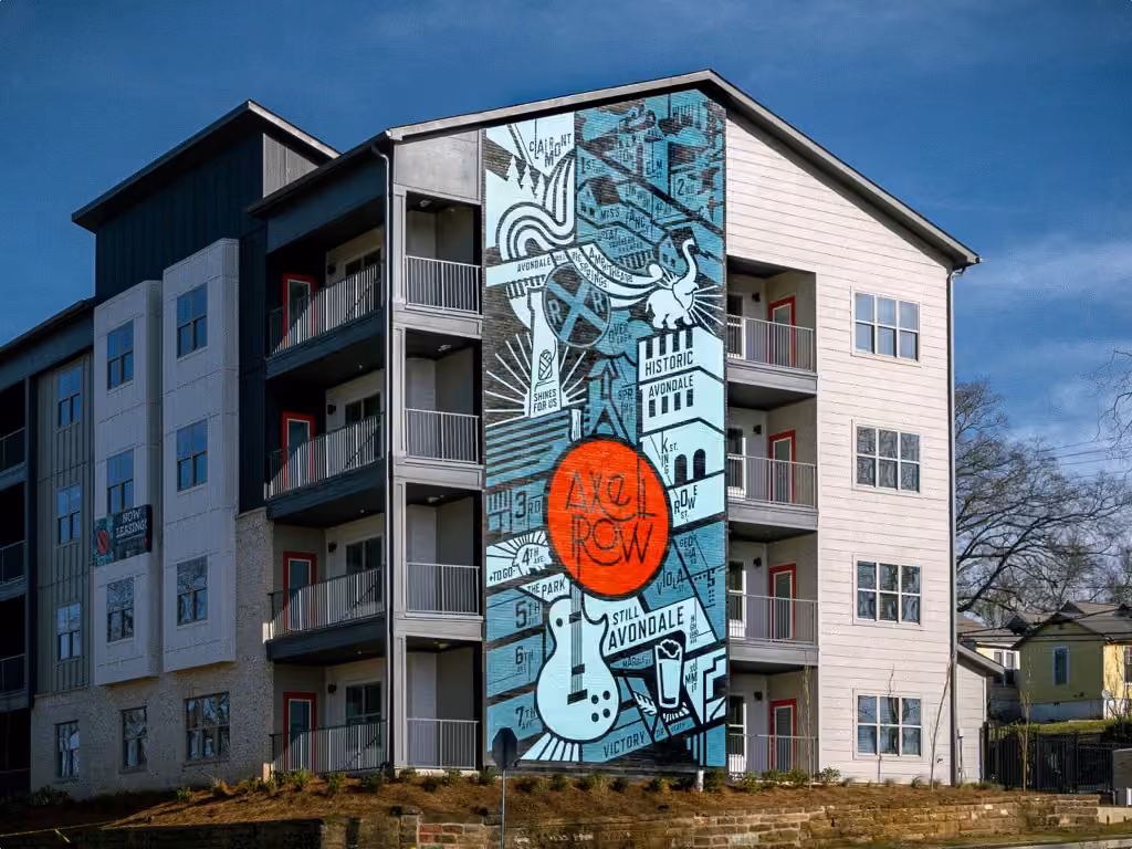 Front facade of a building with a big mural