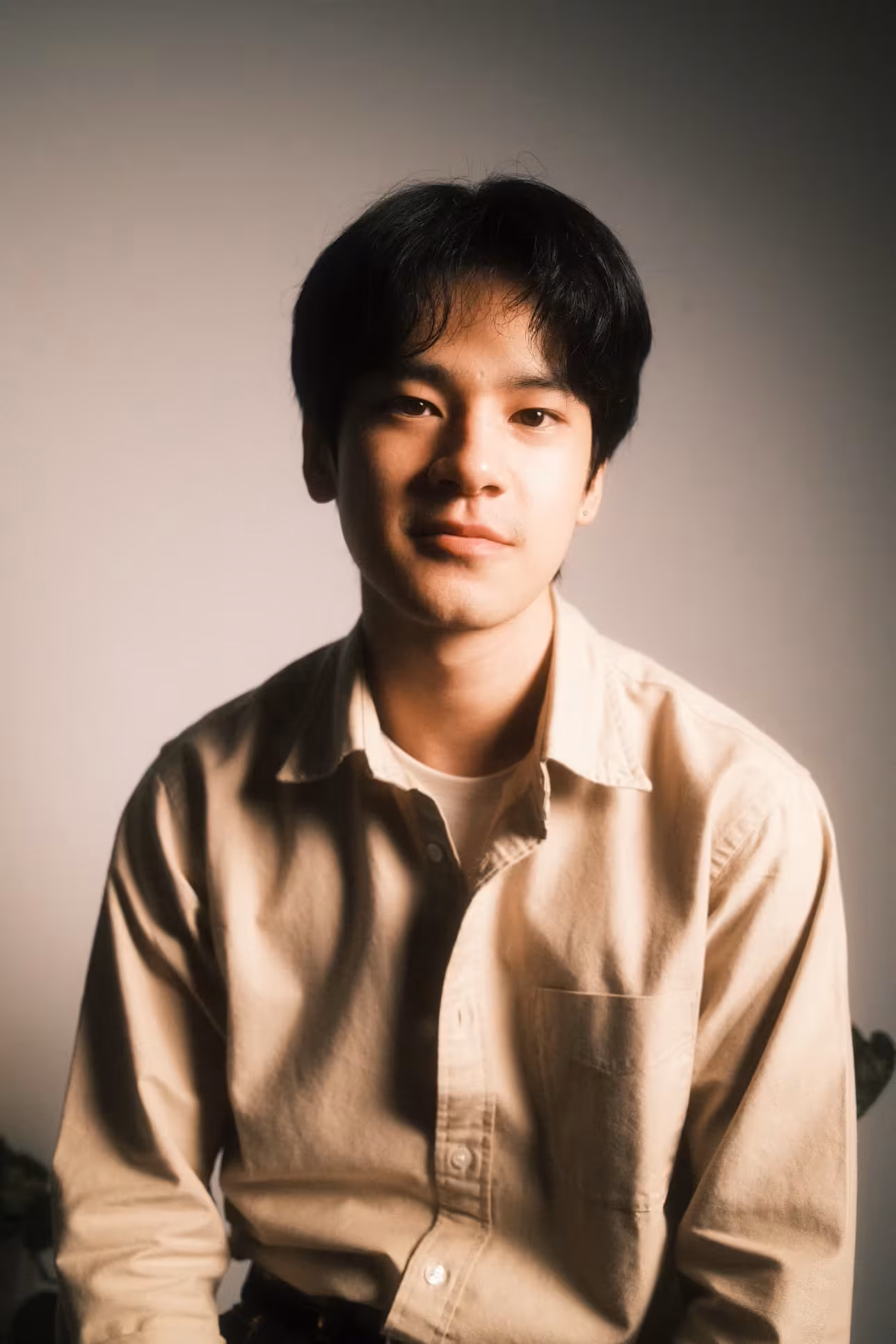 A headshot of Huy